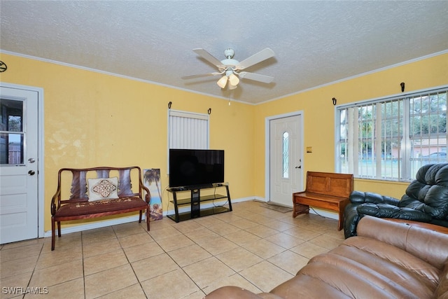 tiled living room featuring crown molding, a textured ceiling, and ceiling fan