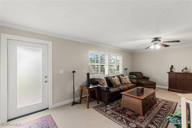 carpeted living room with ceiling fan, ornamental molding, and a textured ceiling