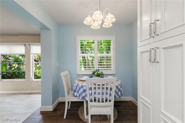 dining room featuring an inviting chandelier and hardwood / wood-style flooring