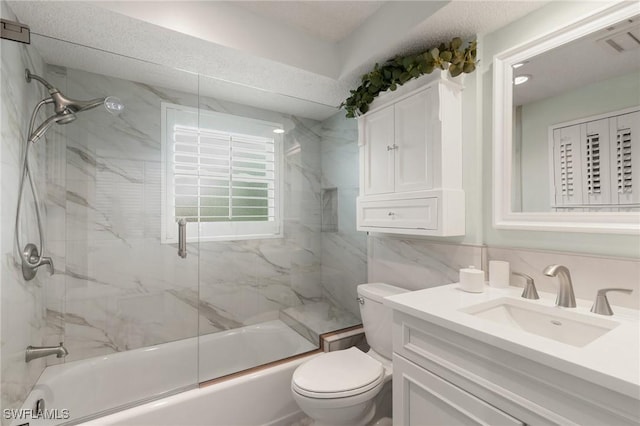 full bathroom with toilet, combined bath / shower with glass door, tile walls, and vanity