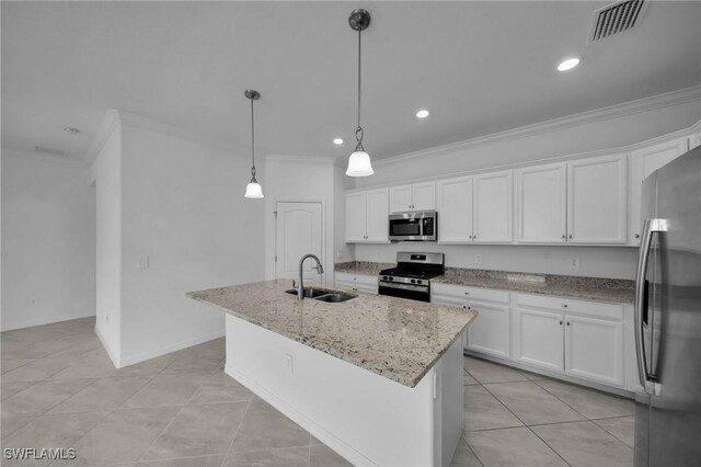 kitchen with an island with sink, white cabinetry, stainless steel appliances, and a sink