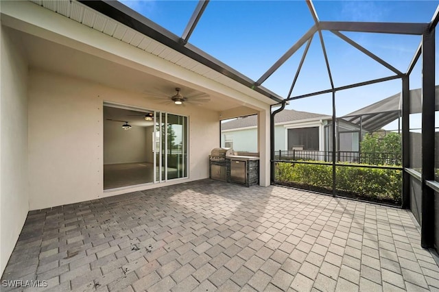 unfurnished sunroom with a ceiling fan