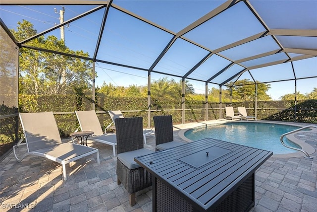 outdoor pool featuring a patio and a lanai