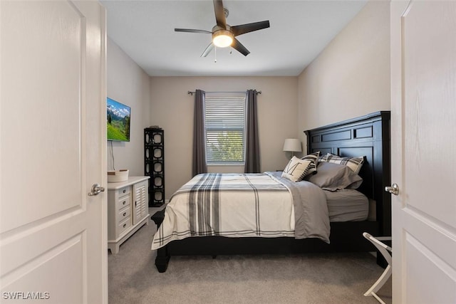 bedroom with ceiling fan and carpet floors