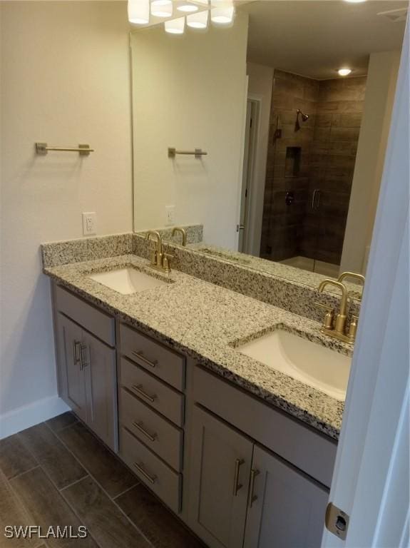 bathroom with an enclosed shower and vanity