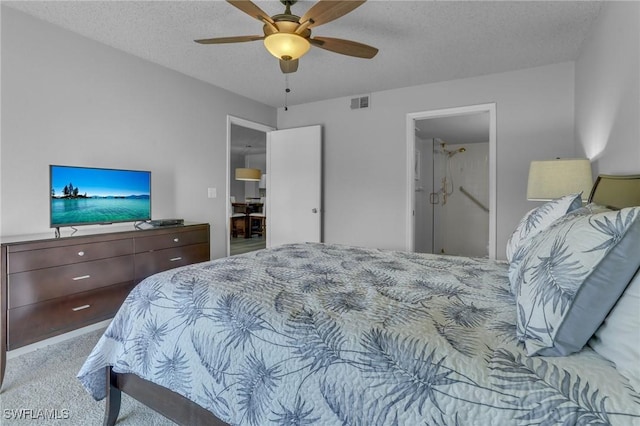 bedroom featuring ceiling fan, light carpet, and a textured ceiling