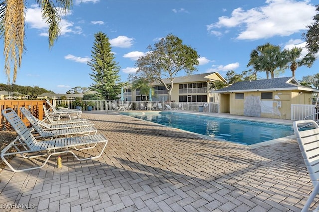 view of swimming pool with a patio