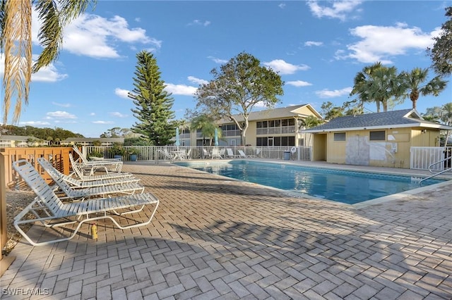 view of swimming pool featuring a patio area