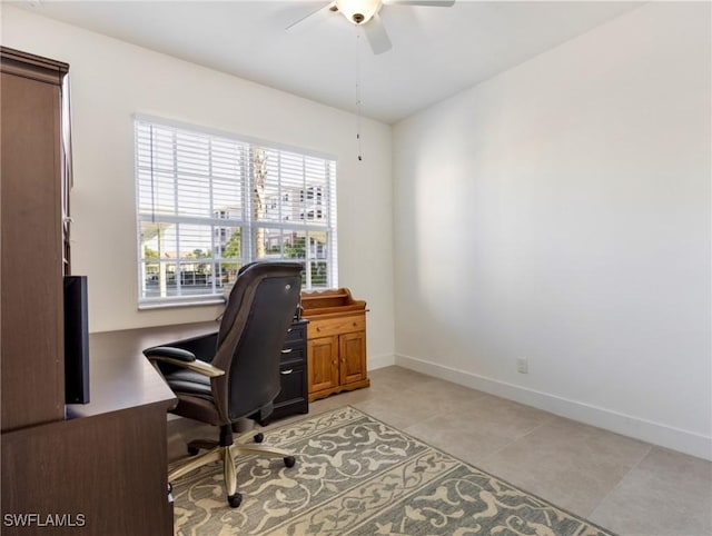 tiled office space featuring ceiling fan