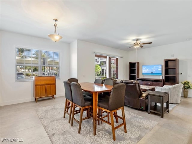 dining room with ceiling fan and light tile patterned floors