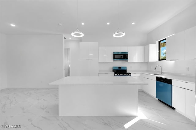 kitchen featuring sink, white cabinetry, a kitchen island, pendant lighting, and stainless steel appliances