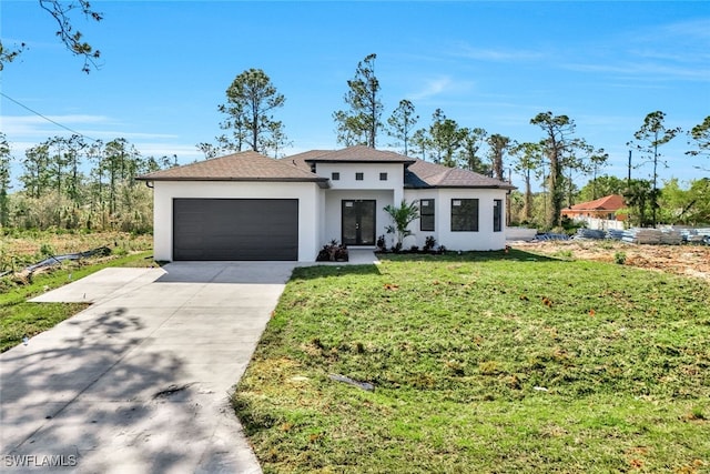 view of front facade featuring a garage and a front yard