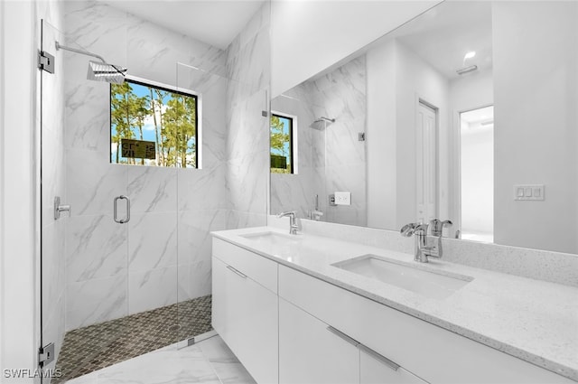 bathroom featuring vanity and an enclosed shower