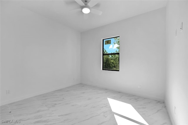 spare room with ceiling fan