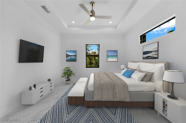 bedroom featuring a tray ceiling and ceiling fan