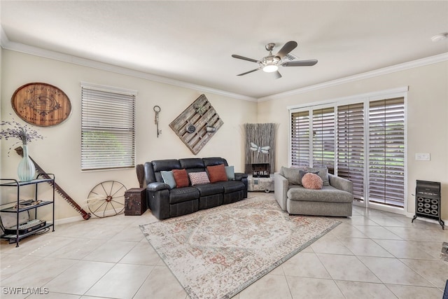 living room featuring ceiling fan, light tile patterned floors, and ornamental molding