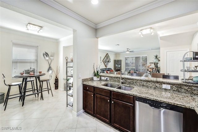 kitchen with ceiling fan, light stone countertops, ornamental molding, stainless steel dishwasher, and sink