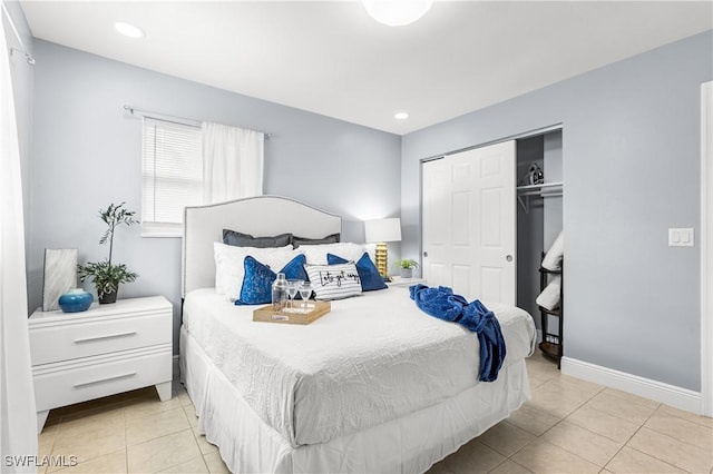 tiled bedroom with a closet