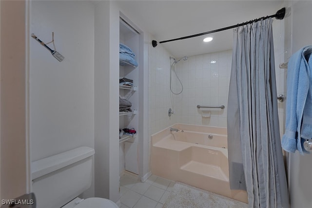 bathroom featuring toilet, tile patterned flooring, and shower / tub combo