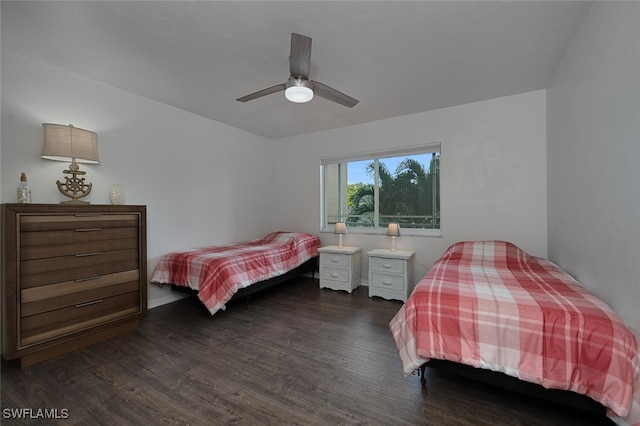 bedroom with ceiling fan and dark wood-type flooring