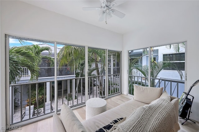 sunroom / solarium featuring ceiling fan