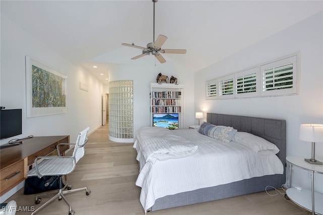 bedroom featuring lofted ceiling, light hardwood / wood-style floors, and ceiling fan