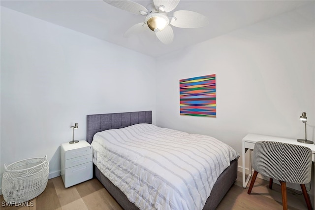 bedroom featuring light hardwood / wood-style floors and ceiling fan