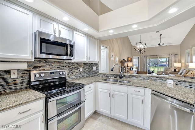 kitchen with sink, white cabinets, and stainless steel appliances