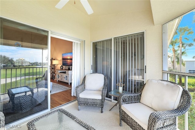 sunroom with ceiling fan and a wealth of natural light