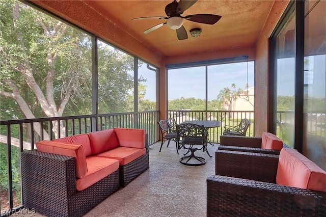 sunroom / solarium with ceiling fan