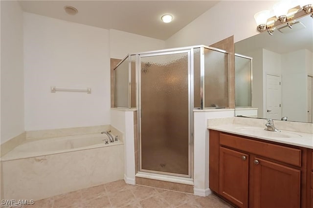 bathroom featuring vaulted ceiling, shower with separate bathtub, tile patterned floors, and vanity