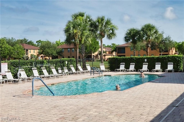 view of swimming pool with a patio