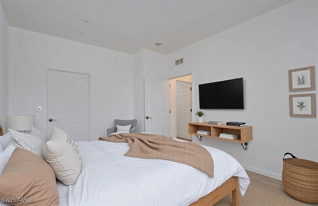 bedroom with a closet and light wood-type flooring