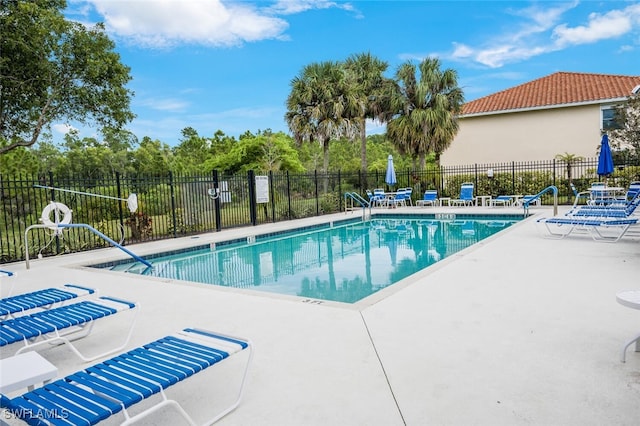 view of swimming pool with a patio