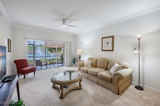 living room with ceiling fan, light carpet, and ornamental molding