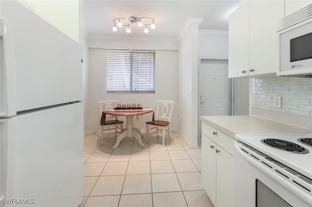 kitchen featuring light tile patterned floors, white cabinetry, decorative backsplash, and white appliances