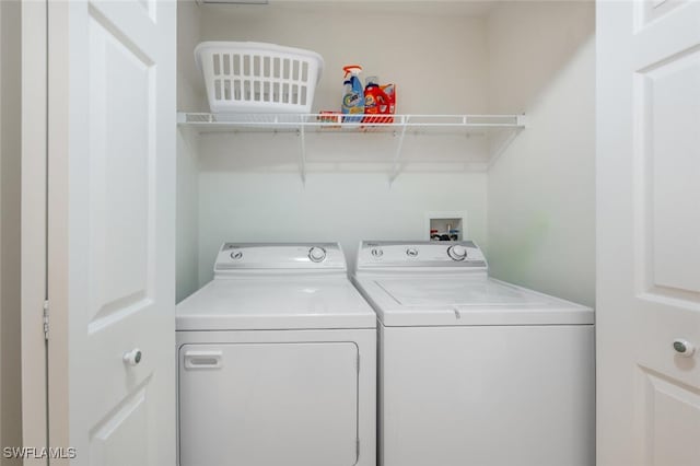 washroom featuring washer and dryer