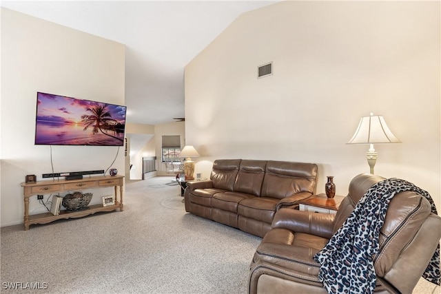 living room featuring carpet and lofted ceiling