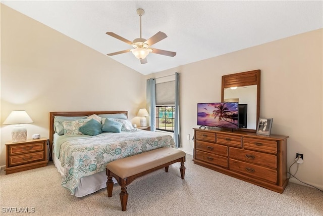 bedroom with ceiling fan, light carpet, and lofted ceiling