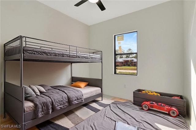 bedroom featuring wood-type flooring and ceiling fan