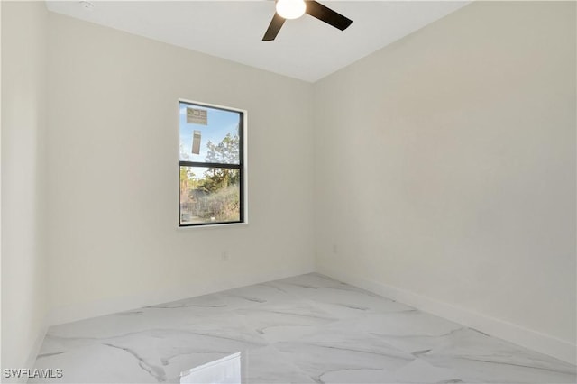 unfurnished room featuring ceiling fan and baseboards