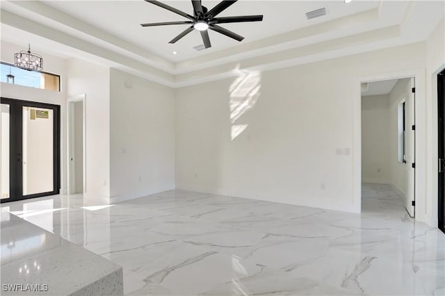 empty room with marble finish floor, french doors, recessed lighting, a raised ceiling, and visible vents