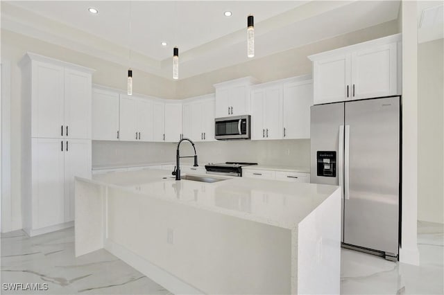 kitchen featuring marble finish floor, stainless steel appliances, a sink, and white cabinetry