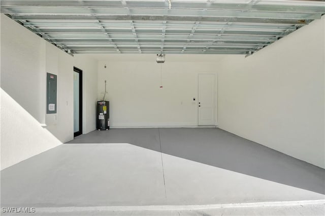 garage with a garage door opener, electric panel, and electric water heater