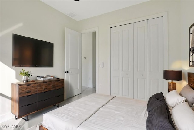 bedroom with a closet and visible vents