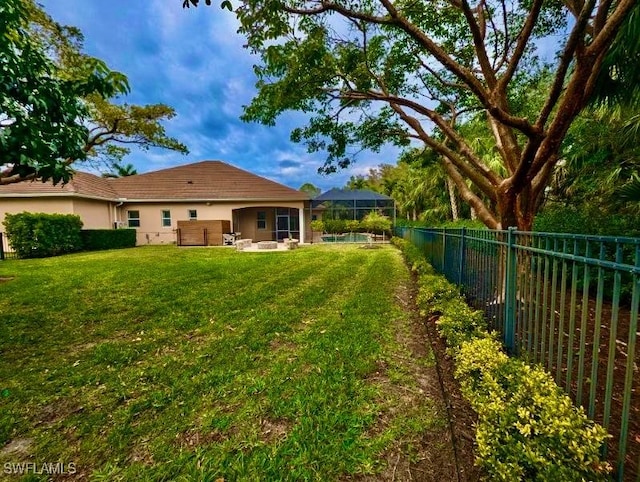 view of yard featuring a lanai