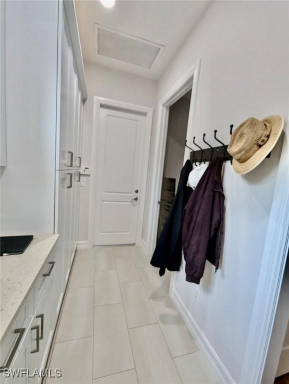 mudroom featuring light tile patterned floors