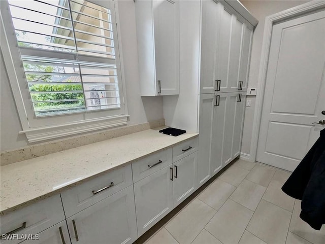 mudroom with light tile patterned floors