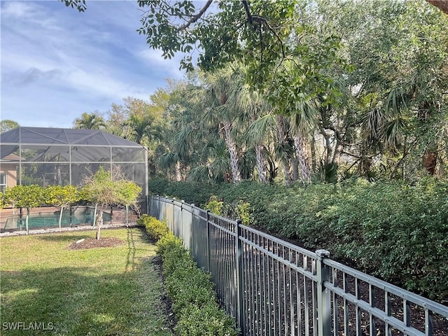 view of yard featuring a lanai