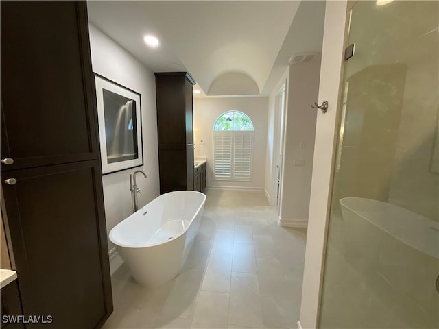 bathroom featuring vanity and plus walk in shower